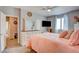 Spacious bedroom features a dresser and large windows with neutral walls and carpet at 3840 Belle Glade St # 104, Las Vegas, NV 89129