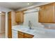 Kitchen featuring a double sink, white countertops, and ample cabinetry at 447 Temple Canyon Pl, Henderson, NV 89074