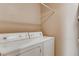 Bright laundry room features a washer and dryer for easy laundry convenience at 447 Temple Canyon Pl, Henderson, NV 89074