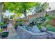 Beautiful backyard featuring a tranquil waterfall, lush greenery, and a brick pathway at 4517 Inez Dr, Las Vegas, NV 89130