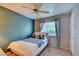 Cozy bedroom with natural light, curtains, and a calming blue accent wall at 4517 Inez Dr, Las Vegas, NV 89130