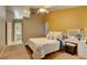 Cozy bedroom features a comfortable bed, ensuite bathroom and a makeup vanity at 4517 Inez Dr, Las Vegas, NV 89130