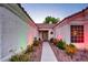 Inviting front entrance with a well-maintained walkway and colorful landscaping at 4517 Inez Dr, Las Vegas, NV 89130