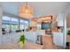 Bright kitchen featuring white cabinets, stainless steel appliances, and adjacent dining area at 4517 Inez Dr, Las Vegas, NV 89130
