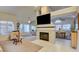 Spacious living room featuring a fireplace, large windows, and a seamless open layout at 4517 Inez Dr, Las Vegas, NV 89130