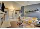 Comfortable living room featuring a fireplace, stylish furnishings, and a welcoming ambiance at 4517 Inez Dr, Las Vegas, NV 89130