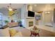 Inviting living room with a fireplace, modern decor, and ample natural light at 4517 Inez Dr, Las Vegas, NV 89130
