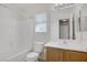 Inviting bathroom showcasing a vanity and well-lit mirror and a separated tub/shower combination at 5135 Paradise Valley Ave, Las Vegas, NV 89156