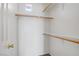 Organized walk-in closet with rod and shelf organization for efficient storage and convenience at 5135 Paradise Valley Ave, Las Vegas, NV 89156