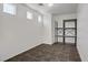 Small room with tiled floor, bright lighting, and shelving unit at 5135 Paradise Valley Ave, Las Vegas, NV 89156