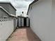 View of metal shed along a brick paved path in a backyard at 5324 Holmby Ave, Las Vegas, NV 89146