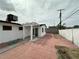 Backyard showcasing a detached structure and block fencing for privacy at 5324 Holmby Ave, Las Vegas, NV 89146