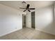 Bedroom featuring tile flooring, a closet, and neutral wall paint at 5324 Holmby Ave, Las Vegas, NV 89146