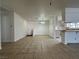 Open concept dining room with hanging light fixture, tile floor and eat-in kitchen at 5324 Holmby Ave, Las Vegas, NV 89146