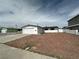 Single story home with a two car garage, small front yard, and ample driveway space at 5324 Holmby Ave, Las Vegas, NV 89146