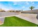 Spacious backyard features artificial turf and gravel landscaping offering a modern and low-maintenance design at 6405 Strongbow Dr, Las Vegas, NV 89156