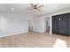 Spacious bedroom with modern ceiling fan, light walls, and doorway to other rooms at 6405 Strongbow Dr, Las Vegas, NV 89156