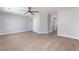 Spacious bedroom featuring a ceiling fan and large closet with sliding doors, enhanced by light-colored flooring at 6405 Strongbow Dr, Las Vegas, NV 89156