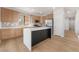 Bright kitchen featuring stainless steel appliances, light wood cabinets and a stylish island at 6405 Strongbow Dr, Las Vegas, NV 89156