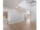 Bright open-plan living room featuring high ceilings and modern hardwood floors at 6405 Strongbow Dr, Las Vegas, NV 89156