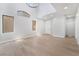 Open-plan living room with high ceilings, natural light and modern flooring at 6405 Strongbow Dr, Las Vegas, NV 89156