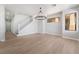 Open floor plan living room with high ceilings and stair case with natural light at 6405 Strongbow Dr, Las Vegas, NV 89156
