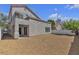 Spacious backyard with low-maintenance desert landscaping, covered patio, and great natural light at 6509 Old Oxford Ave, Las Vegas, NV 89108