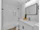 Modern bathroom features a shower, vanity, and quartz countertop at 6509 Old Oxford Ave, Las Vegas, NV 89108