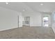 Spacious bedroom with carpet, bright natural light, and access to the outdoor terrace at 6509 Old Oxford Ave, Las Vegas, NV 89108