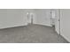 The bedroom includes plush carpeting, a door to the bath and a doorway to a walk-in closet at 6509 Old Oxford Ave, Las Vegas, NV 89108