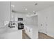 Modern kitchen with white cabinetry, an island, and stainless steel appliances at 6509 Old Oxford Ave, Las Vegas, NV 89108