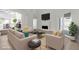 Staged living room with modern furniture, wood-style floors, a fireplace, and sliding glass doors at 6509 Old Oxford Ave, Las Vegas, NV 89108