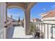 Covered terrace with decorative columns offers an ideal spot for relaxing and enjoying the neighborhood views at 6509 Old Oxford Ave, Las Vegas, NV 89108