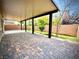 Spacious covered back patio with brick pavers, offering an ideal outdoor entertaining space at 6639 Ivory Dove Ct, Las Vegas, NV 89148