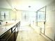 Bright bathroom featuring double vanity, large soaking tub and separate shower with glass enclosure at 6639 Ivory Dove Ct, Las Vegas, NV 89148