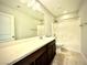 Bright bathroom featuring tile flooring, a tub shower, and a white countertop sink at 6639 Ivory Dove Ct, Las Vegas, NV 89148