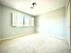 Bright bedroom with neutral carpet, a window with shutters, and soft-colored walls at 6639 Ivory Dove Ct, Las Vegas, NV 89148