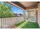 Cozy balcony with artificial turf and a view of the neighborhood at 6868 Sky Pointe Dr # 2013, Las Vegas, NV 89131