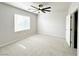 Bright carpeted bedroom featuring a window and closet at 6868 Sky Pointe Dr # 2013, Las Vegas, NV 89131