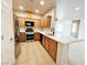 Modern kitchen features stainless steel appliances and spacious countertop area at 6868 Sky Pointe Dr # 2013, Las Vegas, NV 89131