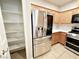 Kitchen area with stainless steel refrigerator and ample storage space at 6868 Sky Pointe Dr # 2013, Las Vegas, NV 89131