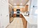 Well-lit kitchen with stainless steel appliances and an island at 6868 Sky Pointe Dr # 2013, Las Vegas, NV 89131