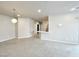 Carpeted living room featuring neutral tones, recessed lighting, and an open floor plan at 6868 Sky Pointe Dr # 2013, Las Vegas, NV 89131