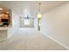 Bright living room featuring carpet floors, a ceiling fan, recessed lighting, and an open-concept layout at 6868 Sky Pointe Dr # 2013, Las Vegas, NV 89131