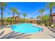 Community pool area with sun loungers, covered seating, and a sparkling pool at 6868 Sky Pointe Dr # 2013, Las Vegas, NV 89131