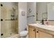 Bathroom featuring a glass-enclosed shower and tile surround, with neutral vanity at 7256 Bugler Swan Way, North Las Vegas, NV 89084