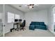 Multi-purpose room includes built-in desk, storage, comfortable seating, and a large window at 7256 Bugler Swan Way, North Las Vegas, NV 89084