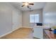 Cozy bedroom with natural light, ceiling fan, closet, and wood-look flooring at 7256 Bugler Swan Way, North Las Vegas, NV 89084