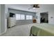 Spacious main bedroom with neutral walls, carpet, and natural light from two windows at 7256 Bugler Swan Way, North Las Vegas, NV 89084