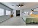 Large main bedroom featuring neutral walls, carpet, and ample natural light at 7256 Bugler Swan Way, North Las Vegas, NV 89084